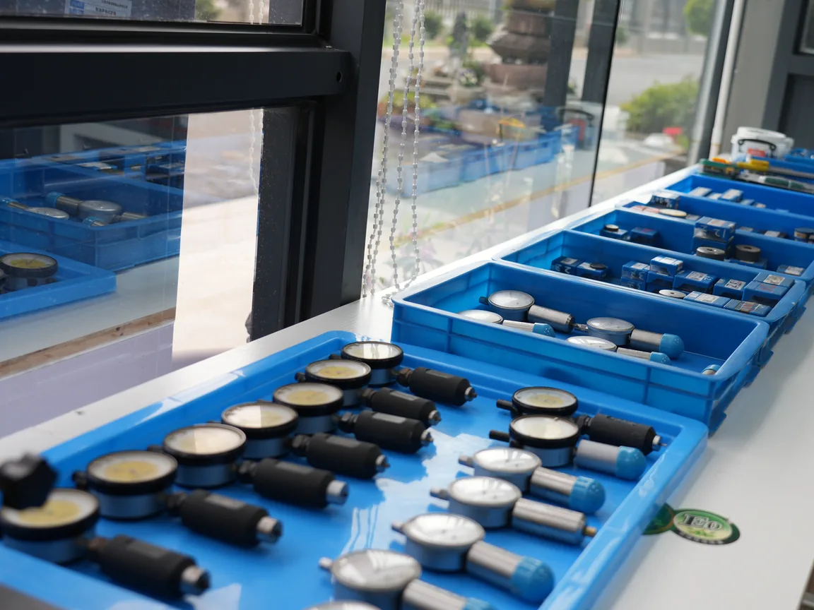 QC dial indicators lined in blue trays on a metrology bench for RFQ dimensional checks